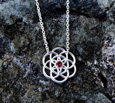 N222 - Silver Petite Seed of Life with Garnet
