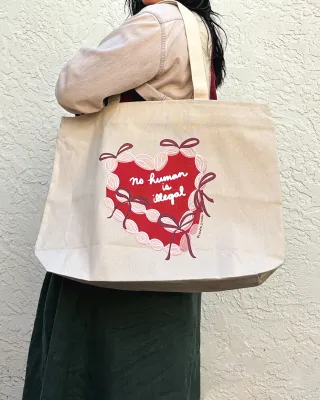 No Human is Illegal Cake Tote Bag