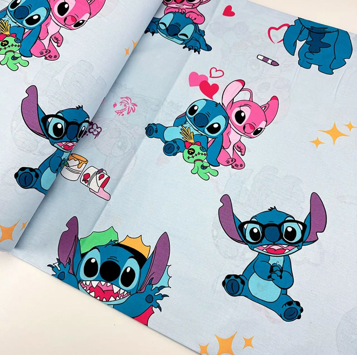 Tessuto di Cotone h240cm “Stitch e Angel” su sfondo azzurro 