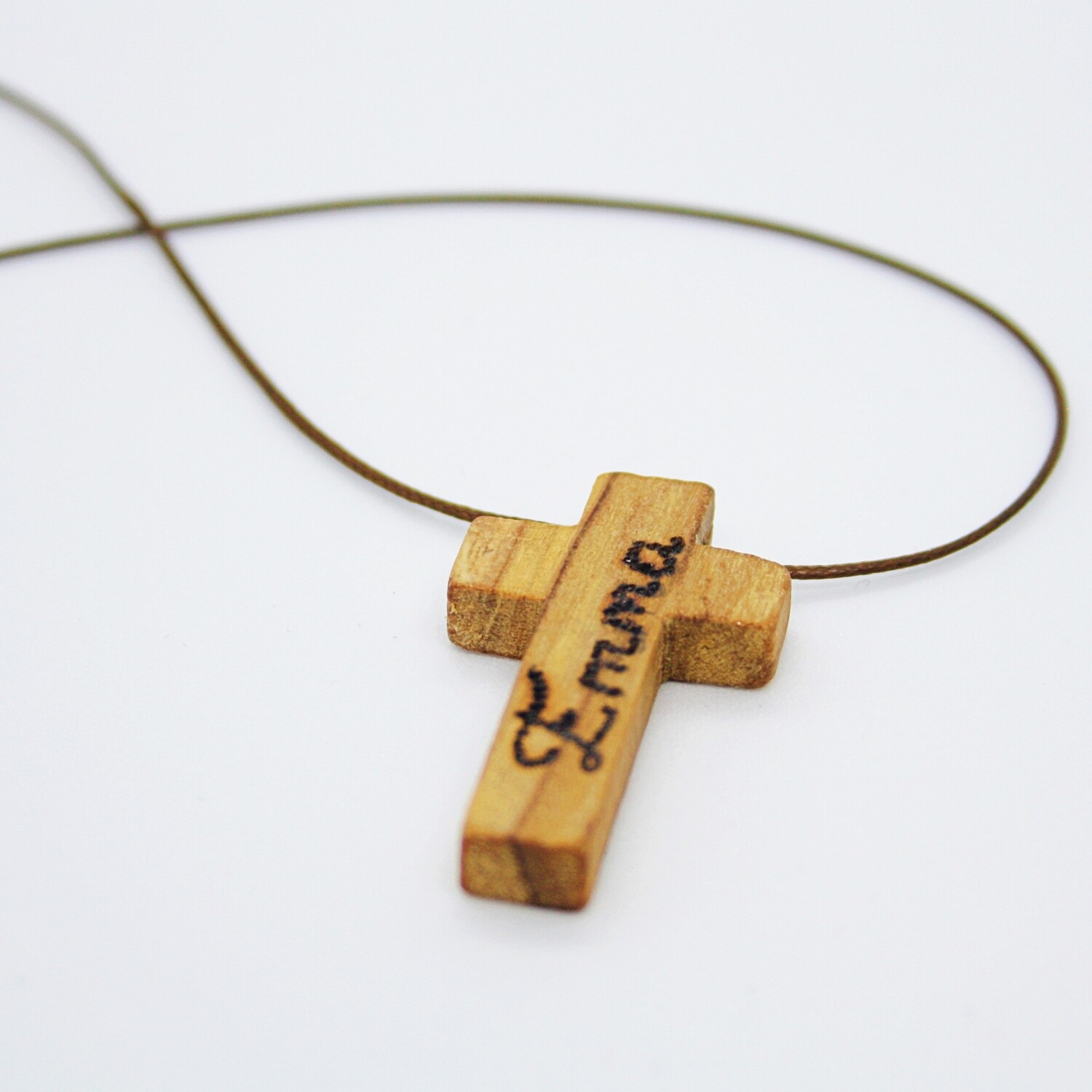 II. PLACE A CROSS ON A STRING WITH INITIALS