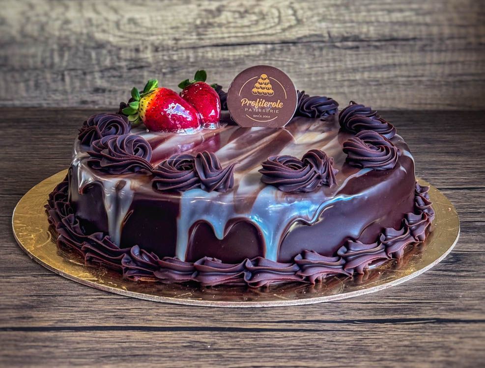 a marble mud cake with chocolate ganache on top