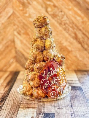 a profiterole tower with toffee with 30 pieces of profiterole