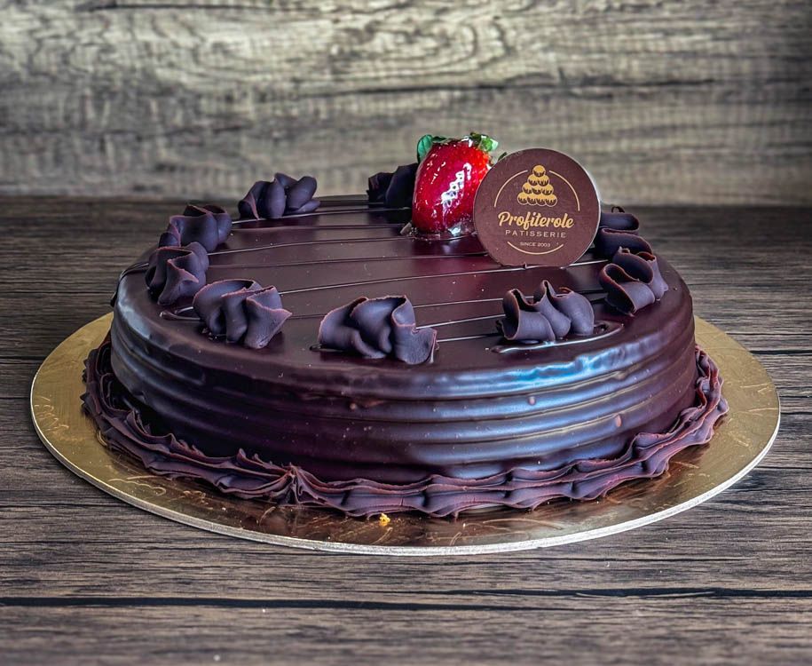 a chocolate mud cake with chocolate ganache on top