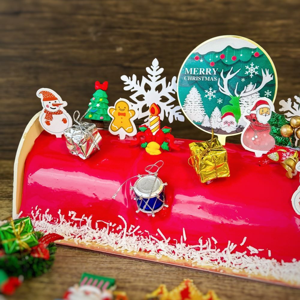 Christmas Log Cake - Ice Cream with ice cream filling and chocolate ganaches decorations, topping with various xmas figure decorations