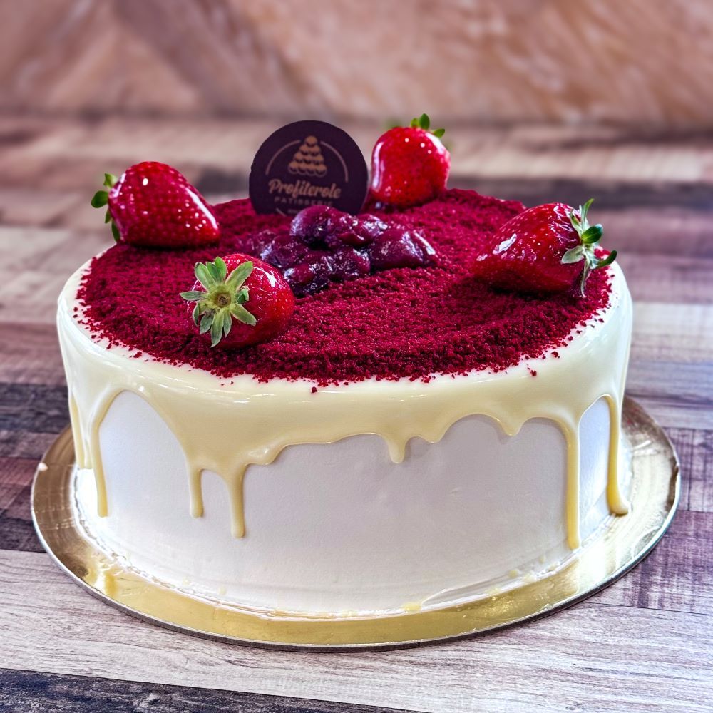 A red velvet cake with fresh strawberries on top