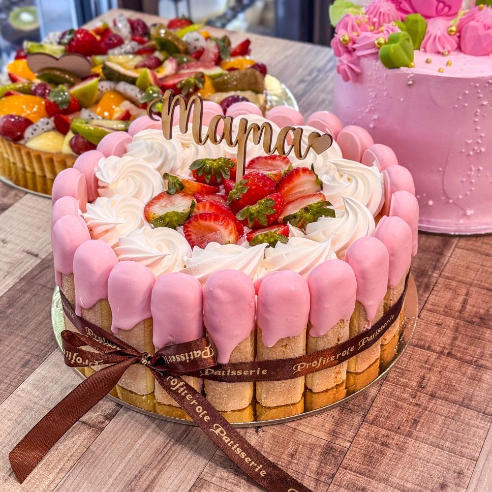 A mother day cake with ladyfingers around and inside is fraisier cake