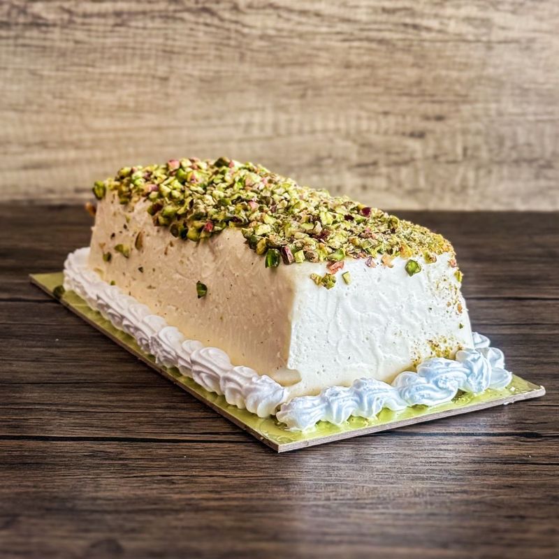 an Ashta ice cream cake topped with pistachio