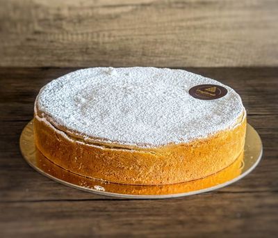 a baked ricotta cheesecake with icing sugar on top