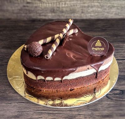 a profiterole chocolate trio cake with a heart shape