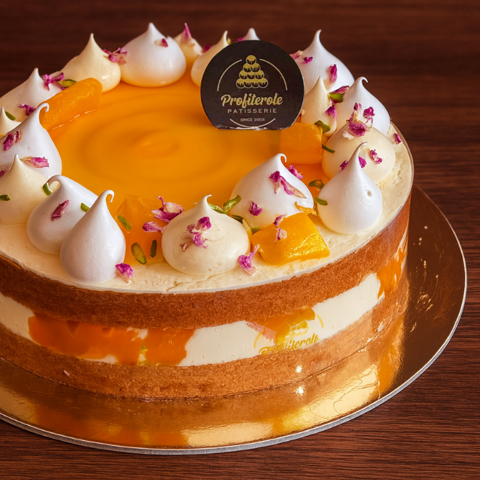 a mango cake with fresh mango pieces & fresh cream