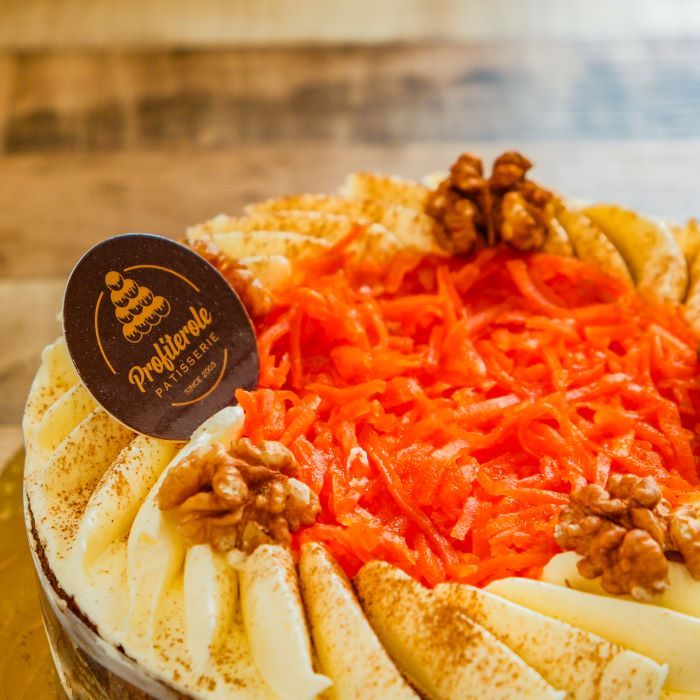 a carrot cake with sherred carrot, sustana and walnuts