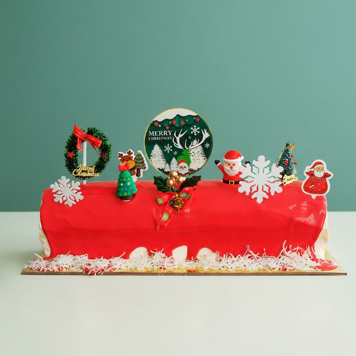 Christmas Log Cake - Ice Cream a red ice cream christmas log with christmas decorations