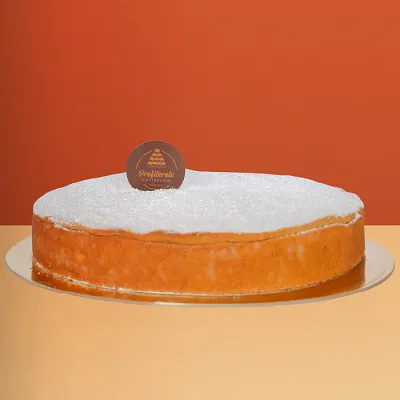 Baked ricotta cheesecake with a golden top dusted with icing sugar on a classic biscuit base by Profiterole Patisserie