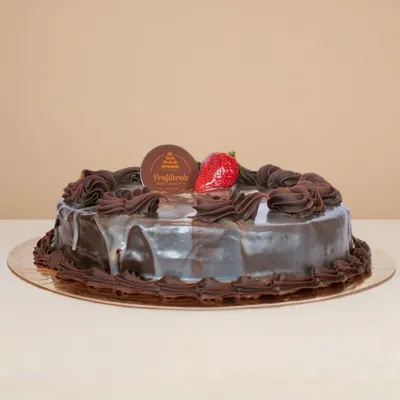 side view of marble mud cake topped with chocolate and strawberry