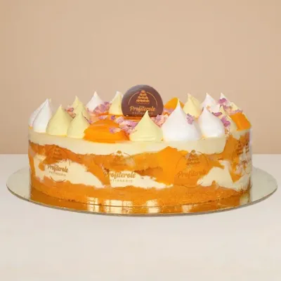 side view of the mango cake showing the alternating cream and fresh mango layers