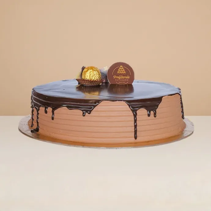 side view of the ferrero rocher cake with the chocolate ganache dripping downwards