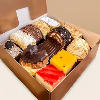 a box of slices of classic cake flavours from profiterole patisserie - option for 8, 10, or 12-piece box
