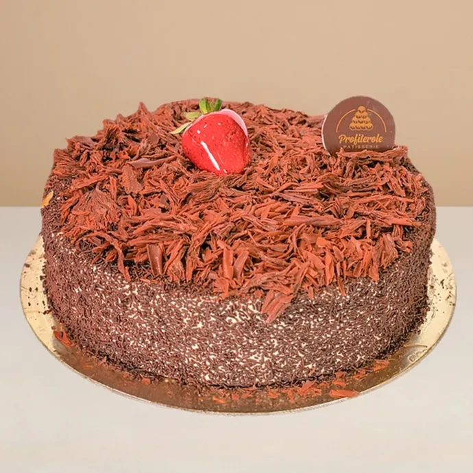 side view of black forest cake covered in chocolate shavings