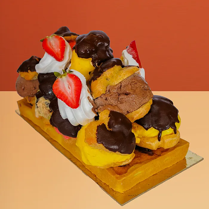 Profiterole ice cream cake with 11 chocolate-dipped profiteroles, gelato & strawberries by Profiterole Patisserie