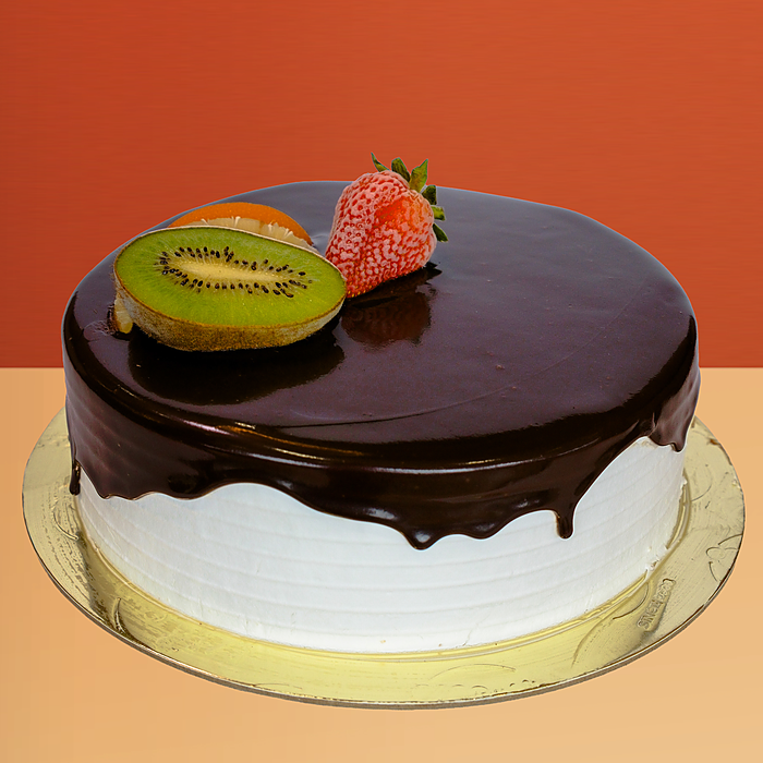 Round ice cream cake with smooth chocolate sauce drip decorated with a fresh kiwi slice and strawberry on top by Profiterole 