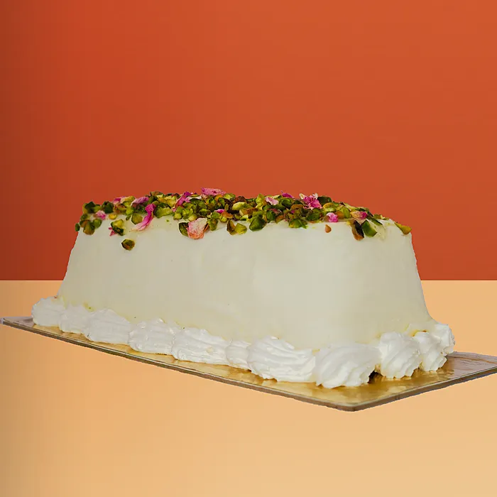 an Ashta ice cream cake topped with pistachio by Profiterole Patisserie