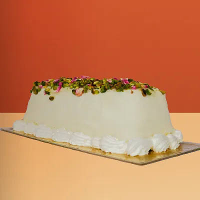 an Ashta ice cream cake topped with pistachio by Profiterole Patisserie