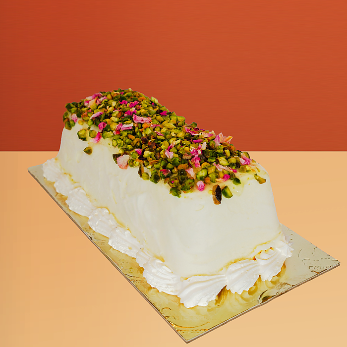 an Ashta ice cream cake topped with pistachio by Profiterole Patisserie