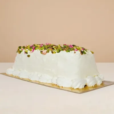 ashta ice cream cake topped with bits of pistachio