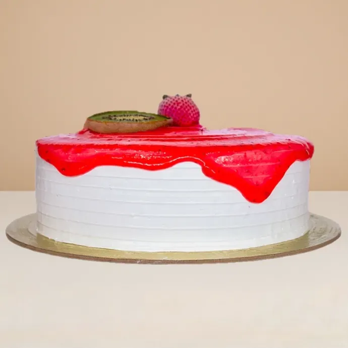 side view of the round ice cream cake with strawberry sauce
