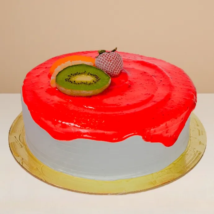 side view of the round ice cream cake with strawberry sauce