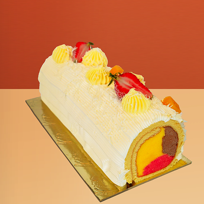 Mango Swiss roll ice cream cake with vanilla sponge, yellow cream piping, mango & chocolate gelato by Profiterole Patisserie