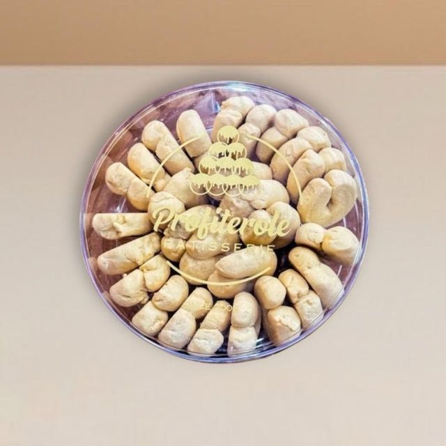 shortbread cookies beautifully arranged inside a clear tub
