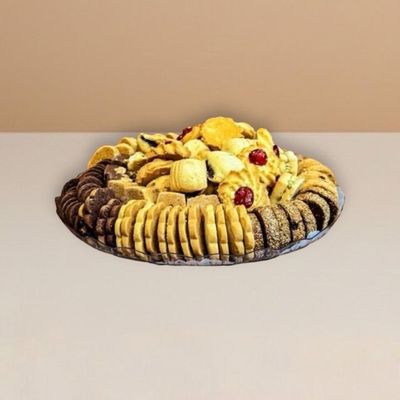 buttery shortbread biscuits nicely arranged and stacked on a clear plate
