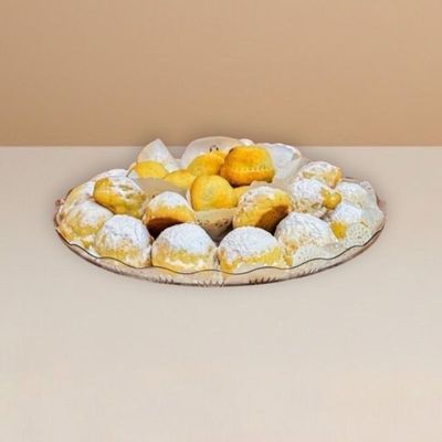 maamoul cookies arranged on a clear plate