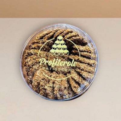 sesame cookies neatly arranged inside a clear tub