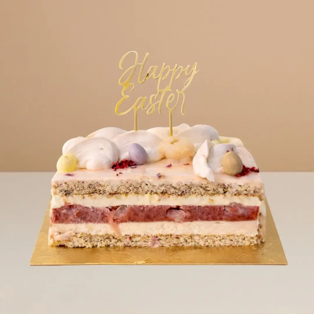 Strawberry lychee blossom Easter cake with almond sponge, vanilla mousse, strawberry lychee coulis, and rose blossom mousse.