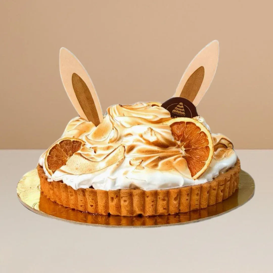 Lemon meringue bunny tart with shortbread base, tangy lemon curd filling, and fluffy French vanilla meringue topping.