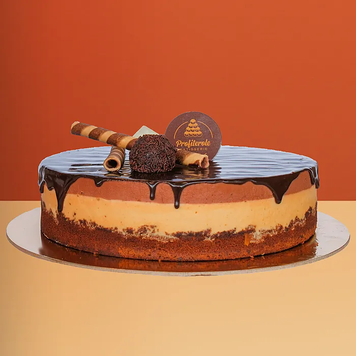 Round trio cake with chocolate & custard layers, ganache, wafer rolls and truffle by Profiterole Patisserie