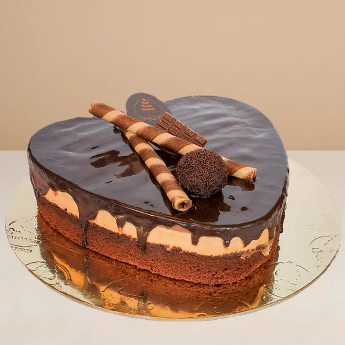 trio cake showing its layers of chocolate fudge, hazelnut, and chocolate mousse
