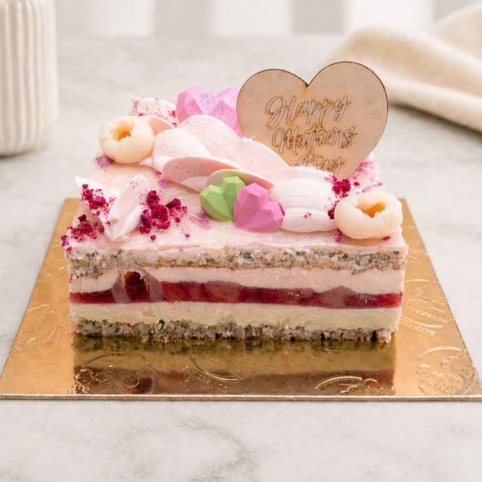 Mother’s Day strawberry lychee blossom cake with pink frosting, layered almond sponge, strawberry and lychee filling