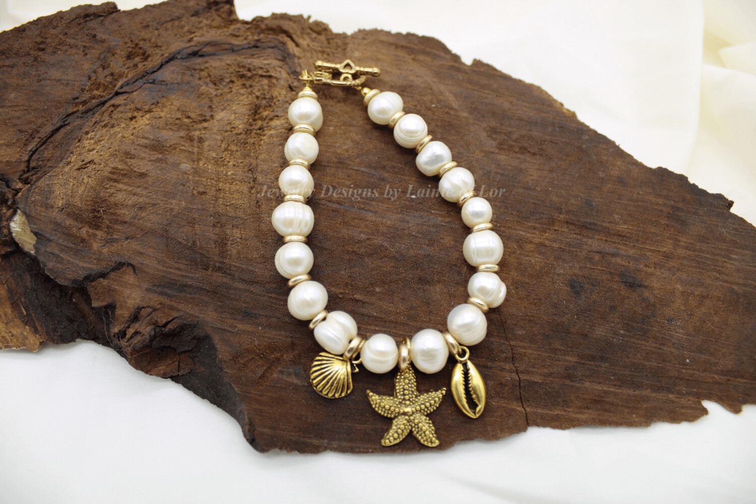 White Freshwater Potato Pearls with Gold Tone Sea Charms Bracelet