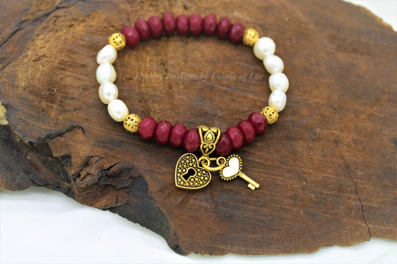 Ruby Jade and White Freshwater Pearls with Gold Tone Charms Bracelet
