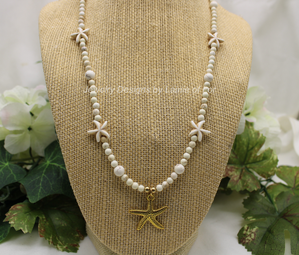 White Magnesite with Howlite Starfish and Gold Tone Shell Charm Necklace