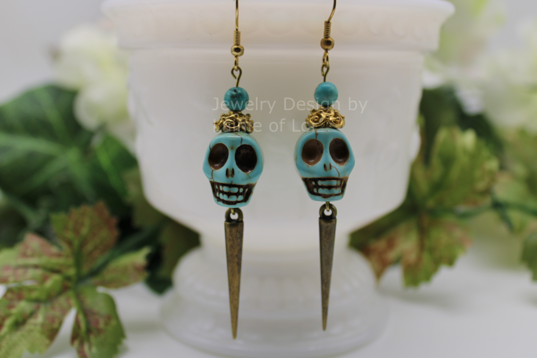Turquoise Colored Howlite Skull Earrings With Gold Plated Spikes