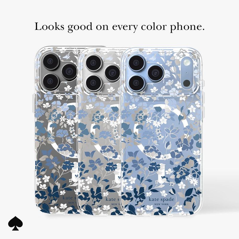 Three Kate Spade New York clear phone cases with a blue and white floral print are shown on a light…