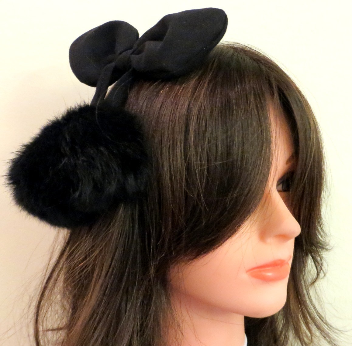 Black bow headband with dangling pom poms