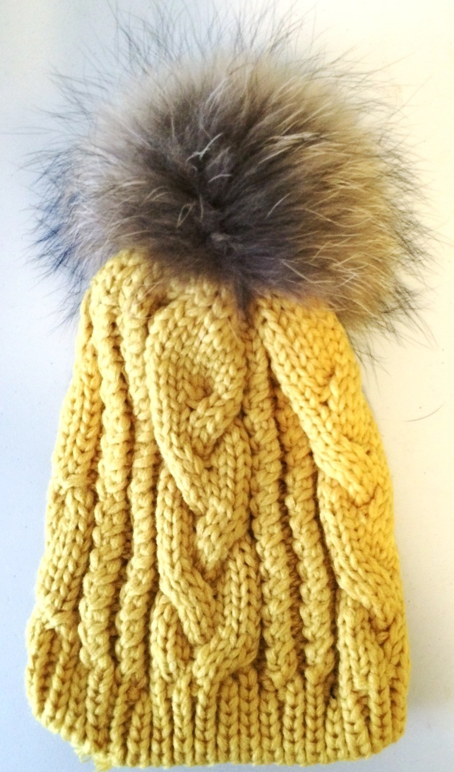 Mustard cable knit fur pom pom hat