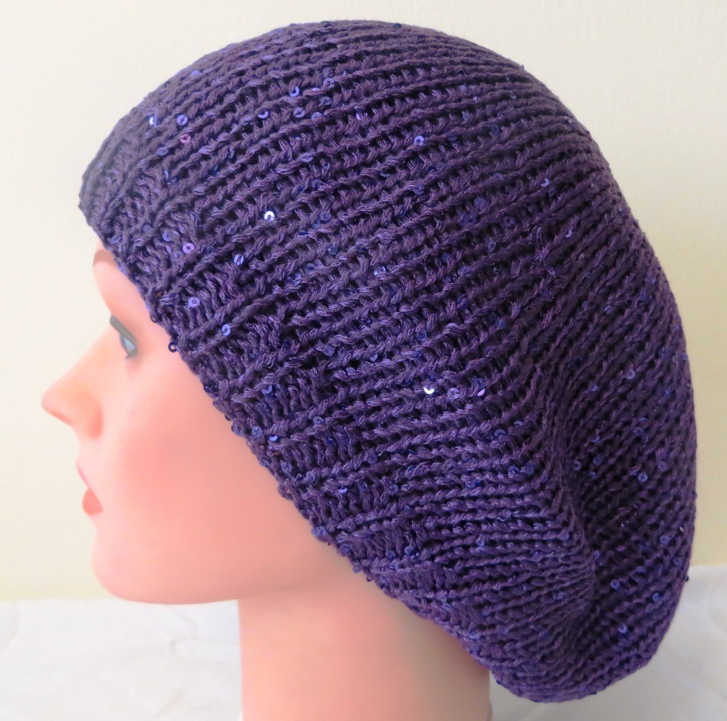 Purple beret with light sparkles