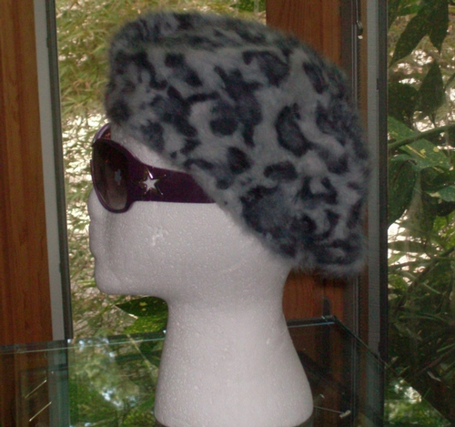 Leopard print beret gray background