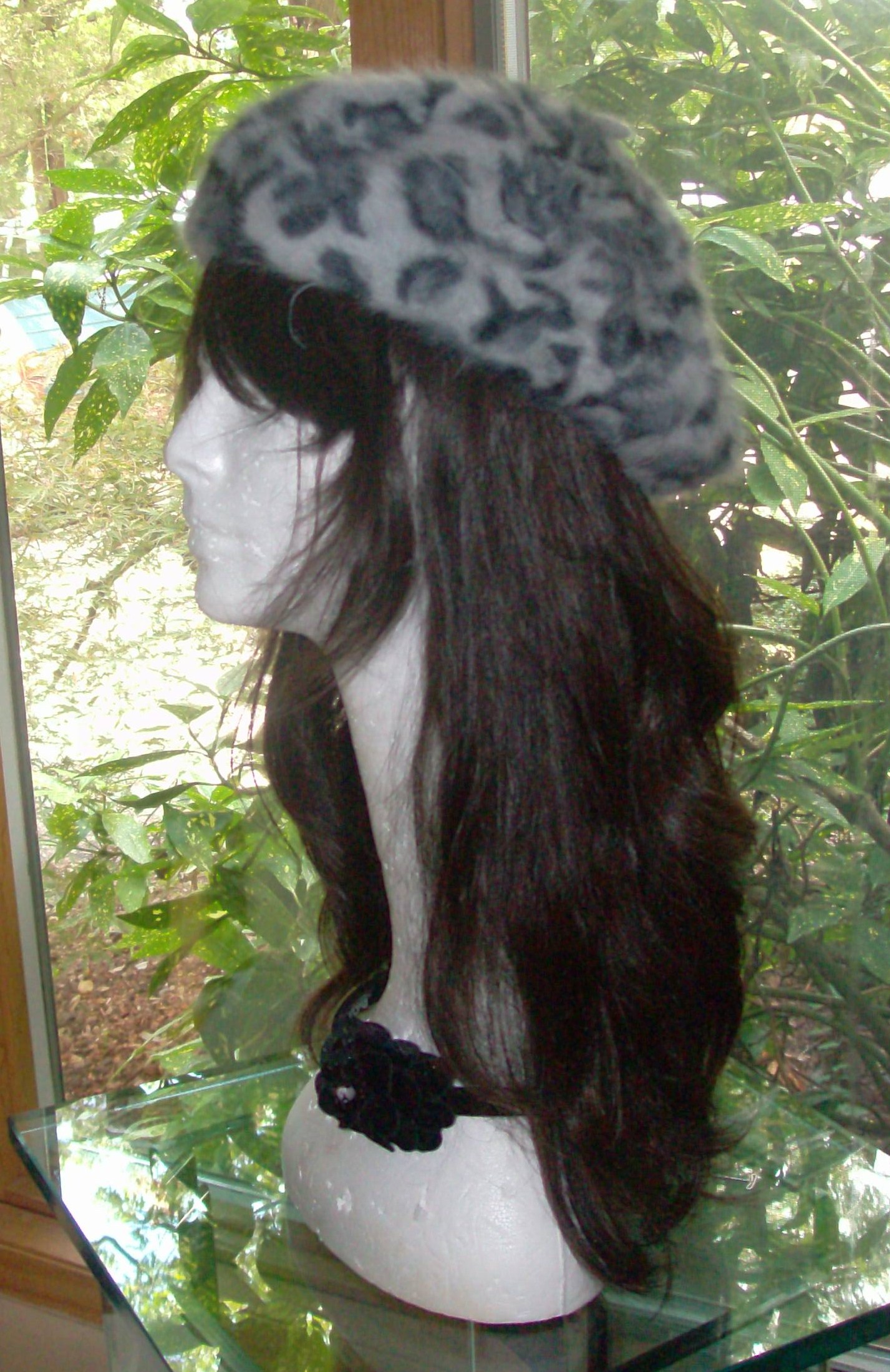 Leopard print beret gray background